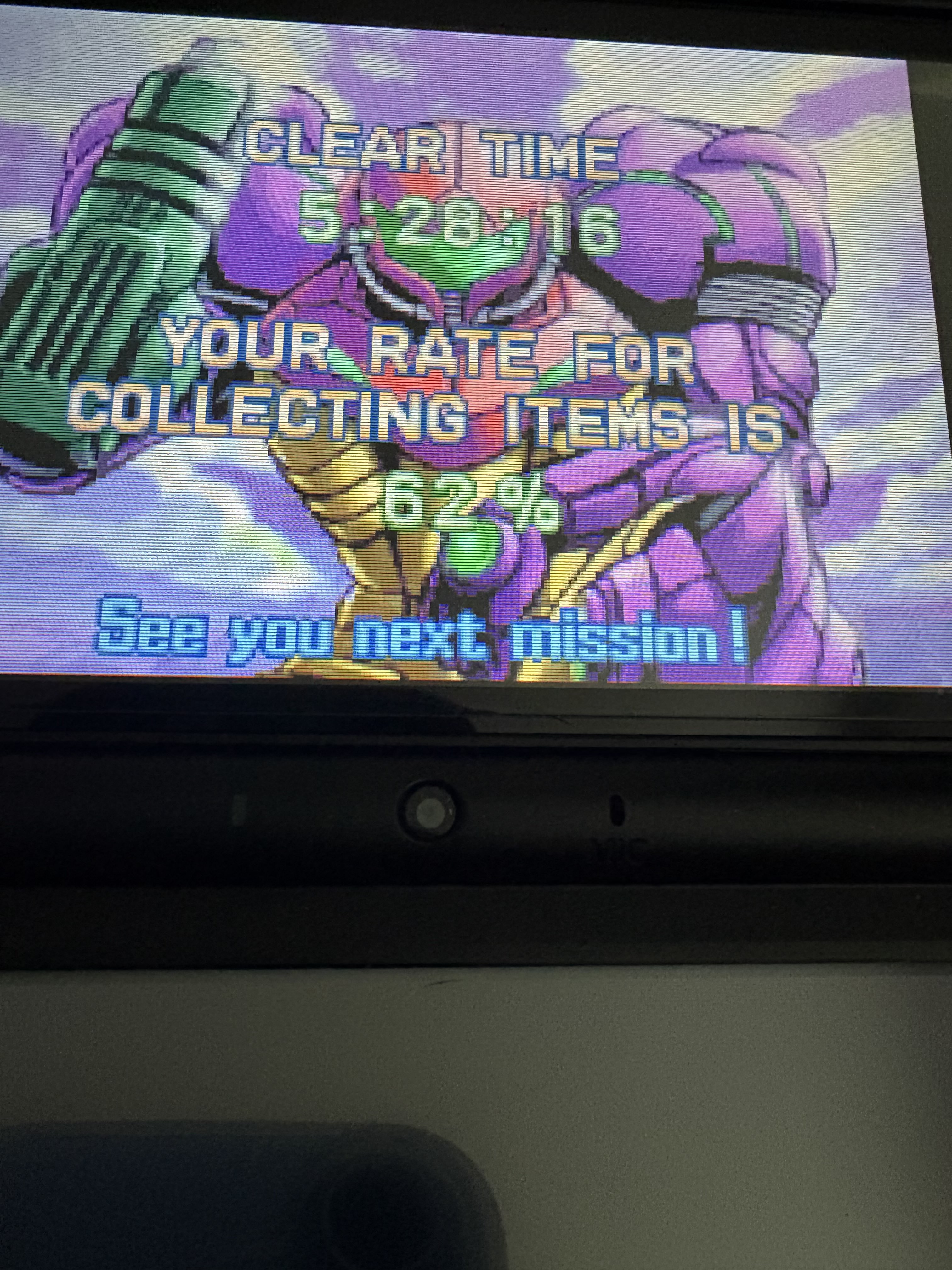 picture of my 2ds screen showing my clear time metroid zero mission at 5 hours 28 minutes and 16 seconds. the background is Samus kneeling in her gravity suit.